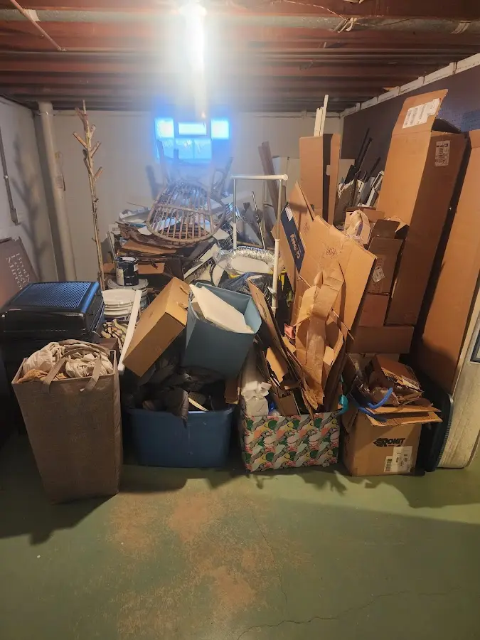 Roll-off dumpster container at job site for 2 Yard Dumpster Rental in West Point